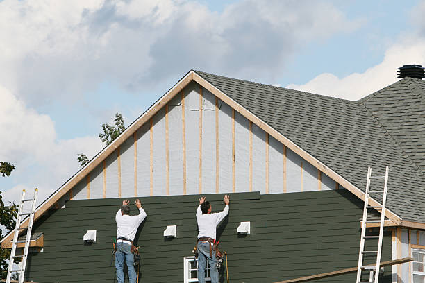 Professional Siding Contractor technician working in Loretto, TN